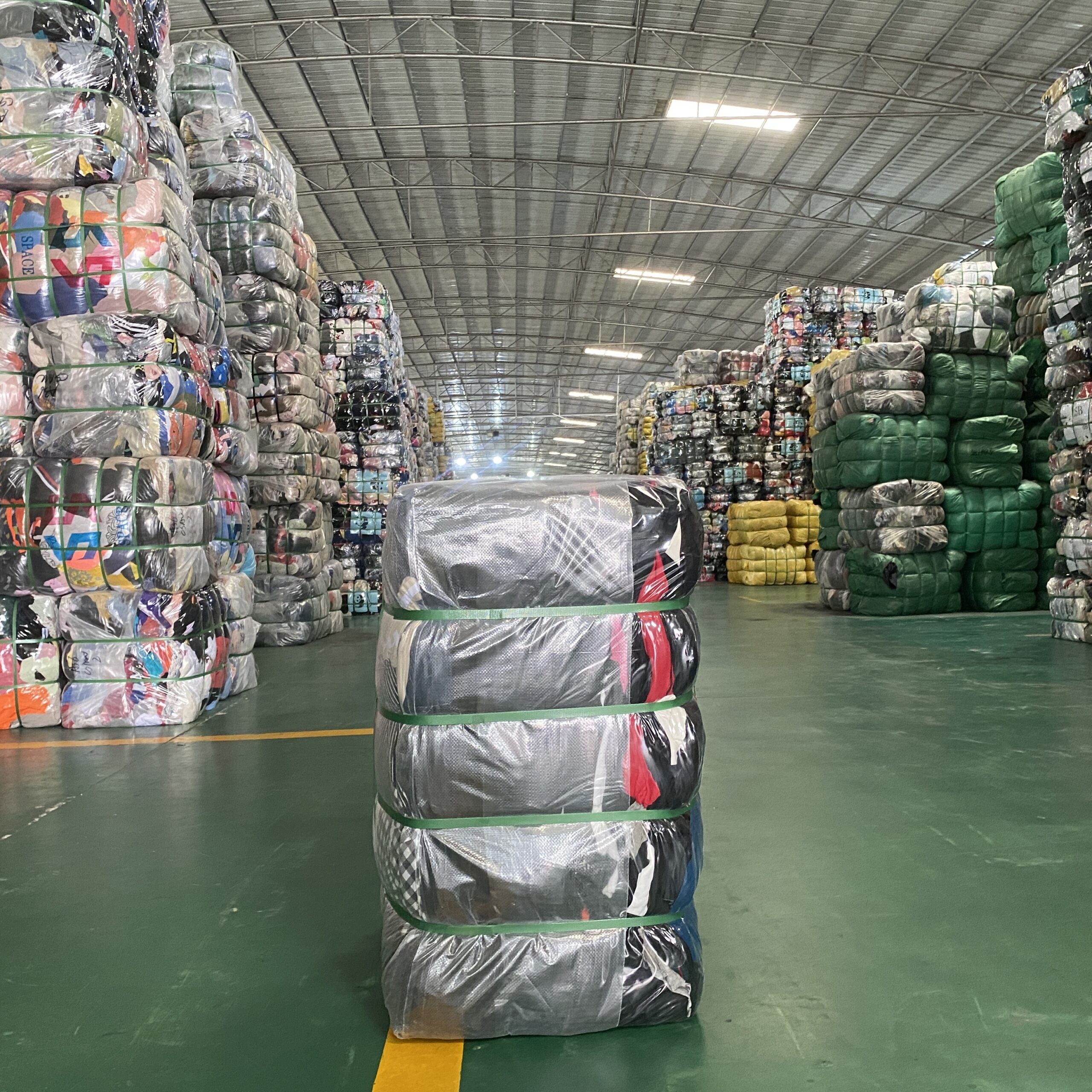 Each bale of used clothing is properly secured to maximize space.